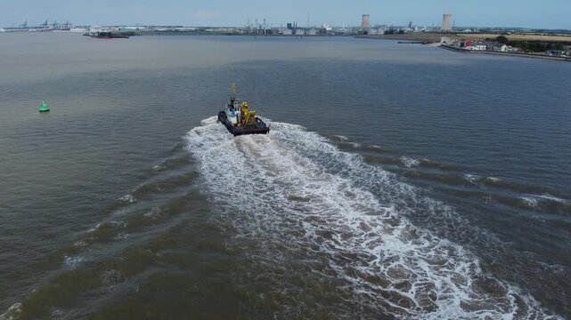 Drone view of a mini dredger carrying out maintenance work on the River Humber. 