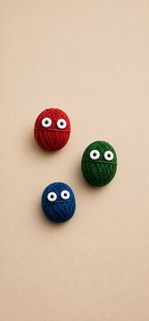 Minimalist Colorful Yarn Ball Characters with Googly Eyes and Copy Space