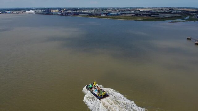 Drone view of a mini dredger carrying out maintenance work on the River Humber. 