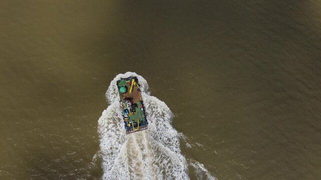 Drone view of a mini dredger carrying out maintenance work on the River Humber. 