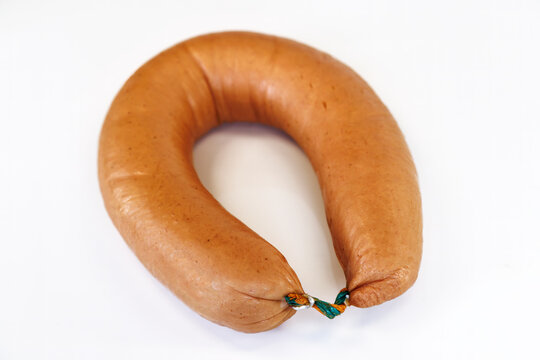 Smoked Fleischwurst sausage ring on white background