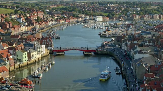 Elevated view of the River Esk running through the historic fishing town of Whitby, North Yorkshire
