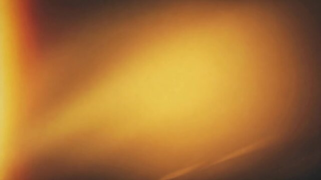 Warm, golden light leaks and lens flares creating a dreamy, abstract, and blurred background effect. A beautiful and soft ambient glow overlay perfect for transitions or adding a vintage feel