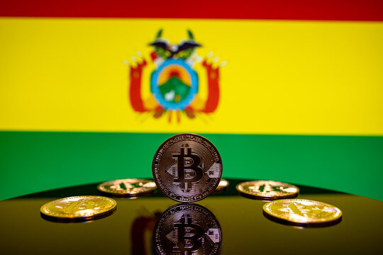 Close up of Bitcoin coins with Bolivia flag background.