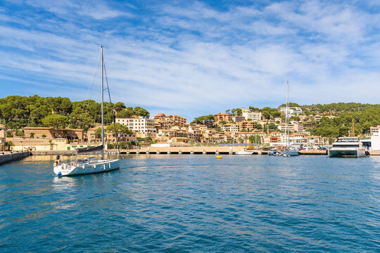 Port de Soller waterfront with Mediterranean buildings and turquoise bay, Mallorca