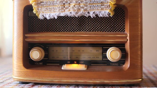 Vintage wood radio featuring illuminated fm dial and classic design, creating a nostalgic atmosphere for a retro listening experience