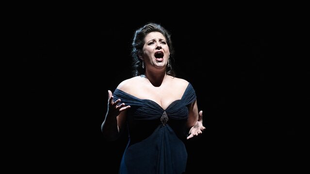 Professional Female Opera Singer Performing Dramatic Solo Aria on Dark Stage