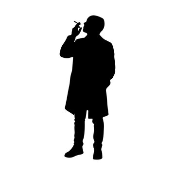 Silhouette of Man Smoking Cigarette in Profile.