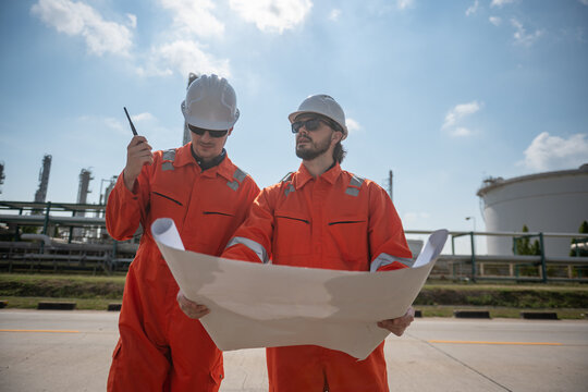 Refinery industry, engineer working in industrial production, oil and gas refinery plant industry factory.