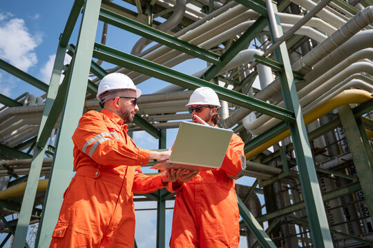 Refinery industry, engineer working in industrial production, oil and gas refinery plant industry factory.