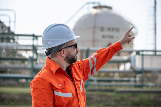 Refinery industry, engineer working in industrial production, oil and gas refinery plant industry factory.
