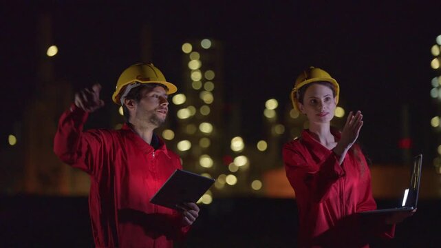 Engineers&rsquo; night shift working oil and gas refinery service, Workers hard work at night petroleum industry plant background, Oil and Gas Petrochemical industry.