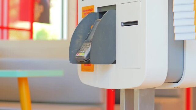 Payment terminal on self-ordering kiosk