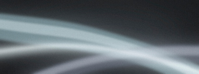 Blue-gray streaks swirl in soft blur, suggesting fast movement and modern speed, useful for sports promotions, transit concepts, or motion-themed designs. © Sergei