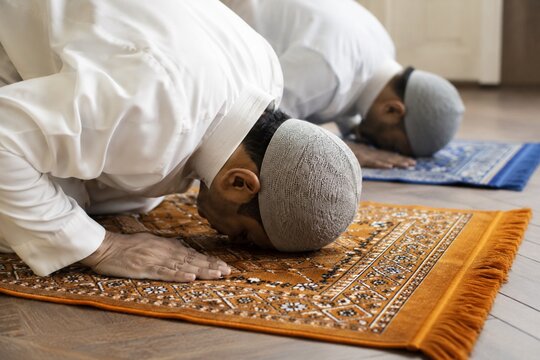 Muslim prayer during sujood on prayer rug