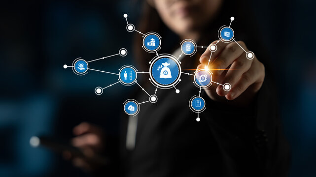 A business professional interacts with digital finance icons, showcasing concepts of investment and wealth management, emphasizing technology and growth potential in business. Tessel