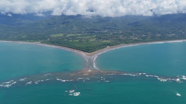 Stunning aerial perspective of the iconic Whale's Tail tombolo at Marino Ballena National Park in Uvita, Costa Rica, during low tide