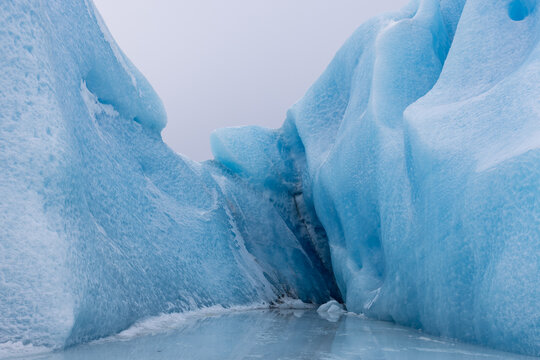 Striking Blue Ice Formations and Frozen Pools of Knik Glacier near Palmer Alaska United States
