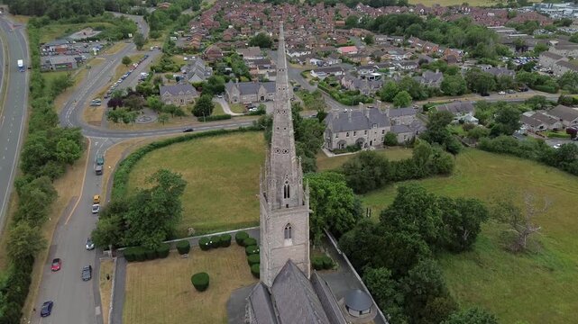 St Margaret's Marble church aerial view orbit above neo gothic steeple overlooking Rhyl community
