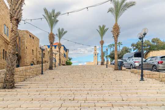 The historic stone stairway in Old Jaffa, Israel, leading up toward Kikar Kedumim Square and the bell tower of St. Peter's Church.
