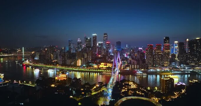 Aerial view of the Chongqing skyline and the Yangtze River bridge at night, China
