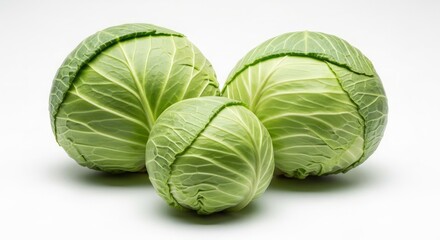 Fototapeta premium Whole Green Cabbage Heads Isolated on White Background for Fresh Vegetable Product Photography