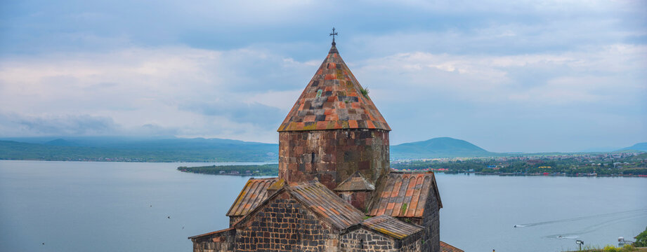 Sevanavank monastery church close up near lake Sevan with cloudy sky copy space