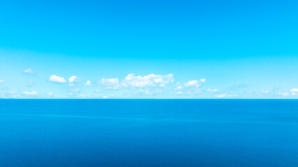 Fototapeta premium Tropical Nature ocean and summer sea water with beautiful bright sunlight. Perfect for summer vacation and travel background 