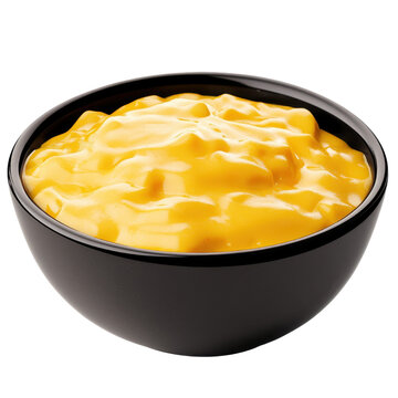 Creamy golden cheese sauce in a sleek black ceramic bowl isolated on white background