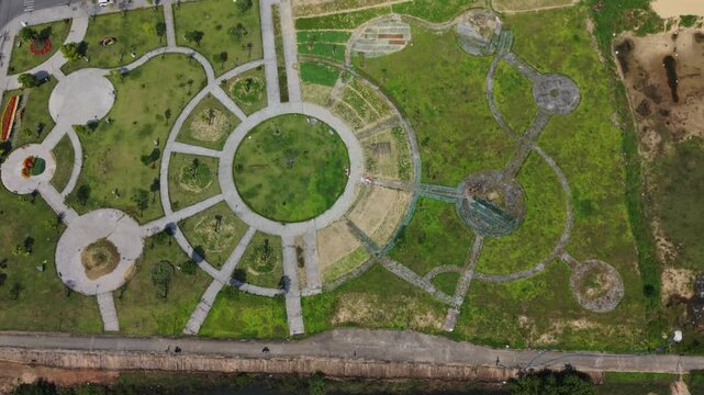 Vietnam, Da Nang Aerial Circular Park Da Nang Showing Radial Pathways, Grassy Central Plaza And Concrete Rings, Adjacent Roadway And Vacant Lots, Calm Atmosphere, Urban Planning