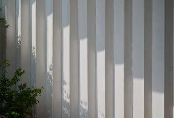 Fototapeta premium Minimalist white architectural wall with natural light and shadows