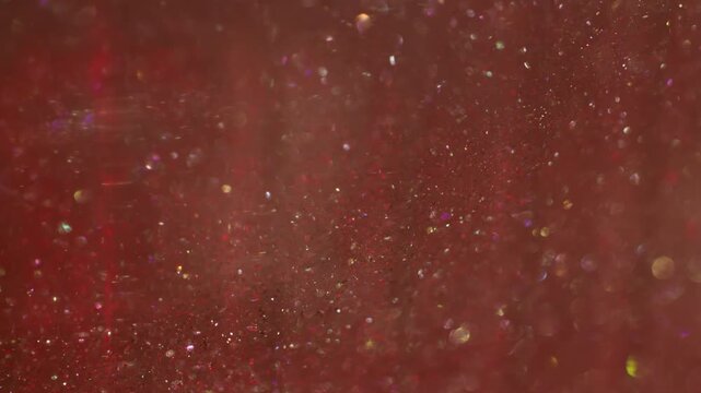 Sparkling stream blur. Shiny particles glare. Red yellow bokeh powder mix flare gradient circles. Color twinkle abstract background.