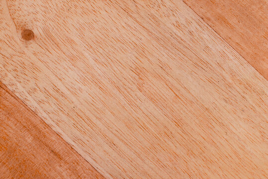 Light brown natural wood grain texture with knot close up background