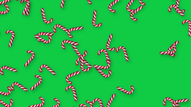 Falling Red and White Striped Candy Canes on Green Screen Background
