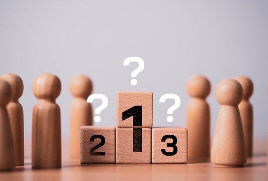 Wooden podium with first, second, and third place blocks surrounded by people symbolizes ranking, competition, decision making, leadership selection, business performance and success evaluation.