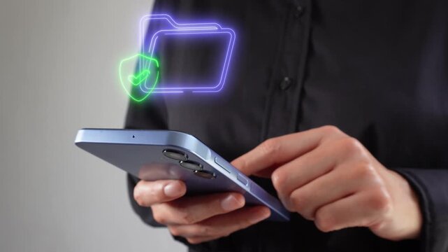 Secure control of business information. Businesswoman with smartphone in hand with a virtual icon of a folder and a shield with a checkmark inside.
