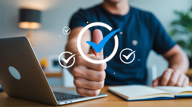 Hand giving thumbs up with digital checkmark icons at laptop computer desk with digital checkmarks manuscriptum manuscripta completion technology