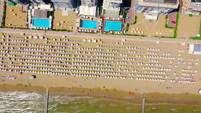 Italy, Jesolo. Lido di Jesolo, or Jesolo Lido, is the beach area of the city of Jesolo in the province of Venice. Drone footage, HEAD OVER SHOT