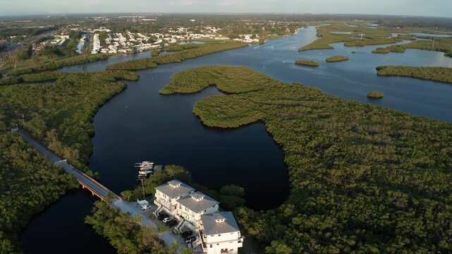 A residential area beside the Braden River, surrounded by lush mangrove islands. Ideal for real estate or environmental documentaries.