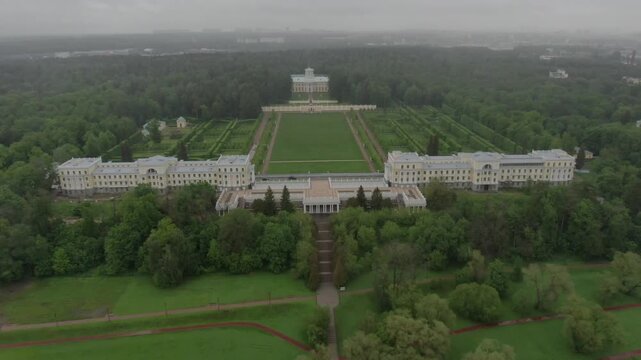 Drone descending and rotating over palace estate
