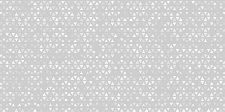 Silver mosaic background of small, shimmering square tiles reminiscent of a disco ball or a sparkling dance floor