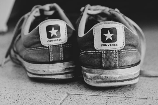 Athens, Greece-October 3,2020.Black and white image shows hard used Converse All Star sneakers from the back side.