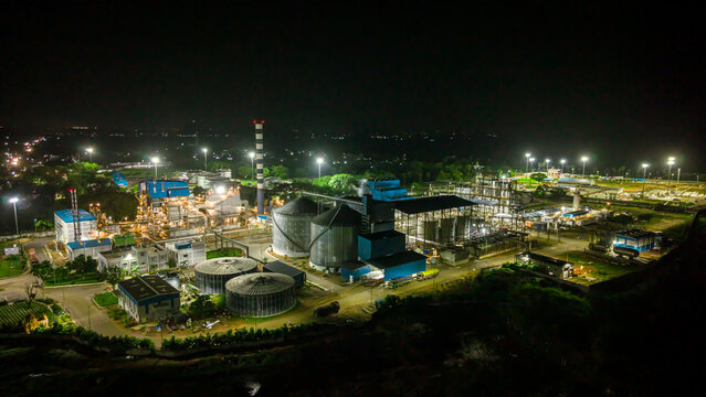 Large ethanol production plant operating at night under full illumination