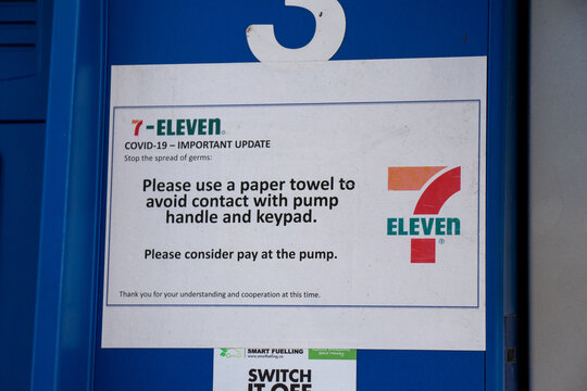 Covid-19 update sign at  Esso Gas Station. Please avoid contact with pump handle and keypad.
