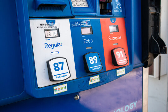 A rack with pumps with different types of fuel at  Esso Gas Station.