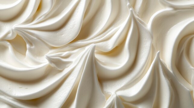 Close-up of swirls of creamy white frosting.