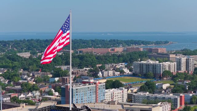 Panoramic Slow-Mo aerial of USA Flag flapping in the wind, rich colors, 4K