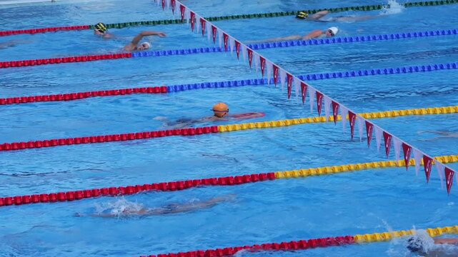 Professional swimmers training for a competition in a swimming pool