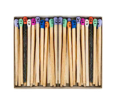 Box with Multicolored matchsticks with faces painted on the heads