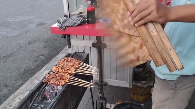 The process of grilling Satay, Delicious Satay Culinary in Indonesia
